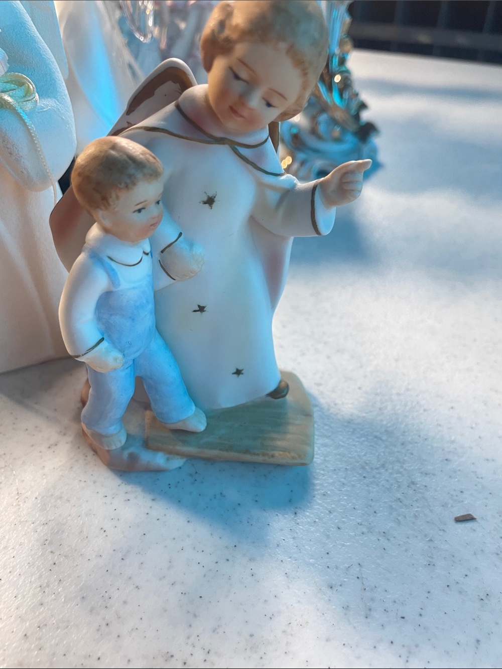 Porcelain Angel Figurine with Child – White and Pastel Blue